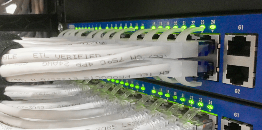 Close-up view of several network cables plugged into an electrical box at the Herriman City Hall