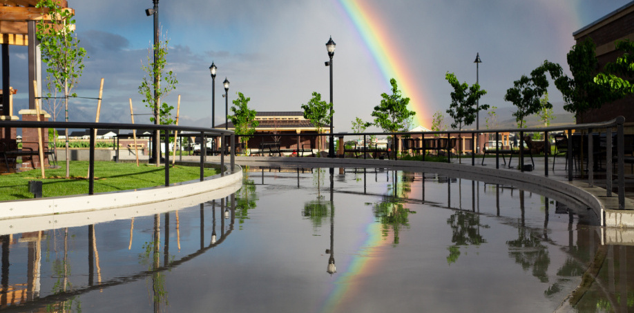 A rainbow shines during sunset at J. Lynn Crane Park