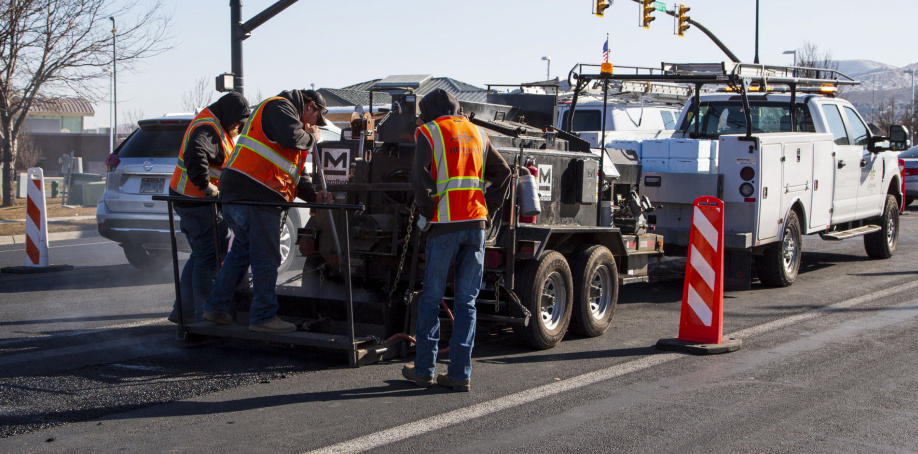 Herriman City crews fixing a road