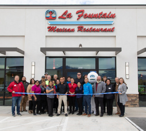 Community members gather for the ribbon cutting of La Fountain