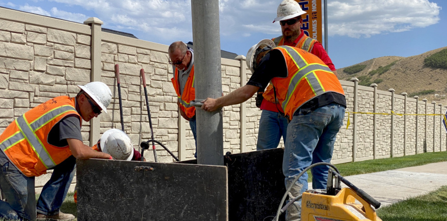 City crews work with a vector truck hose