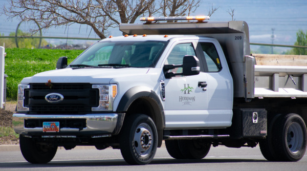 A Herriman City trucks drives to a job