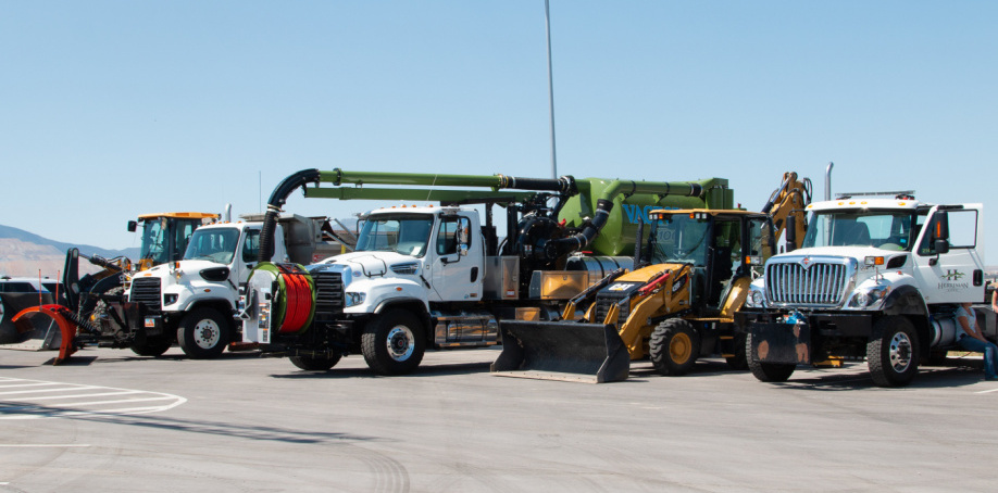 Several Herriman City vehicles lined up for a touch-a-truck event at the Sentinel Ridge Boulevard ribbon cutting