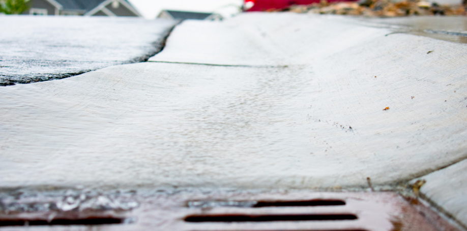 A closeup image of a storm drain during a June 2020 rainstorm